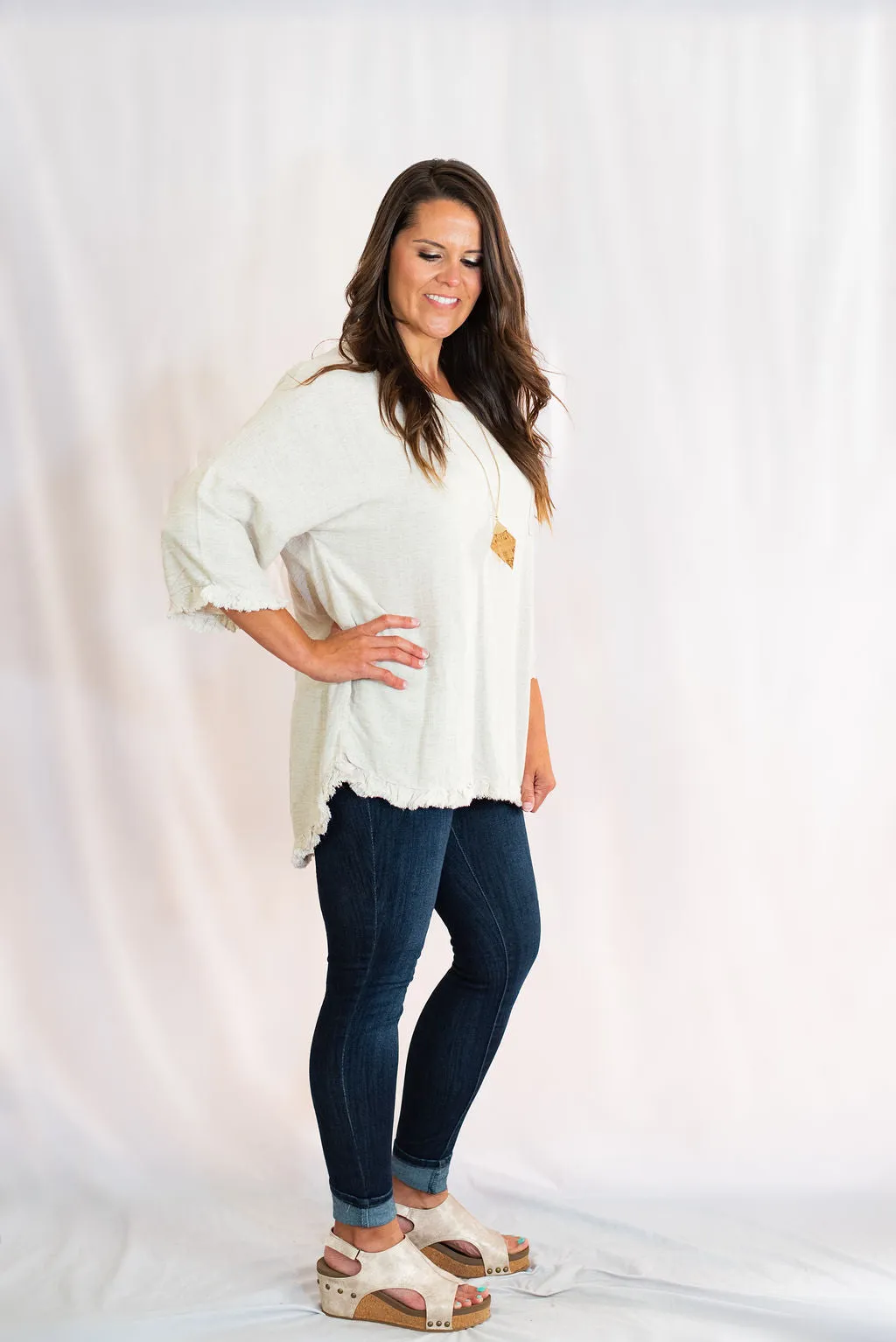 Frayed Hem Top with Long Bell Sleeves and Chest Pocket by Umgee Clothing